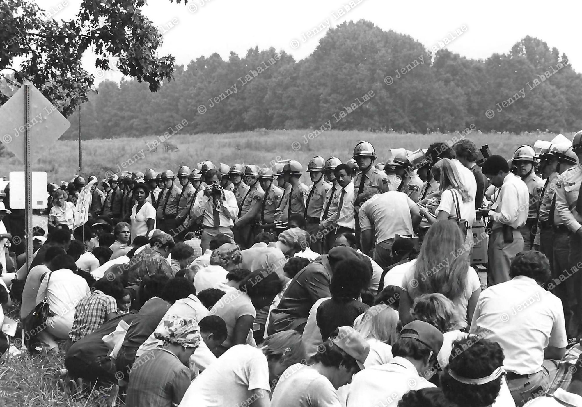 Lines of helmeted North Carolina state troopers holding billy clubs were intimidating. Protesters always knelt in prayer before being arrested